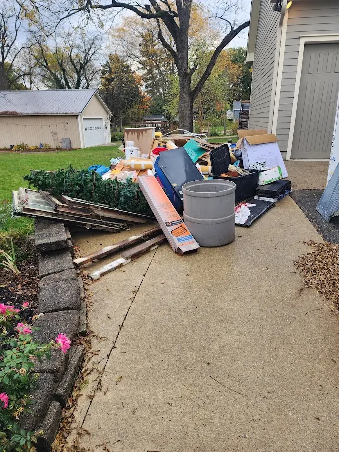 Dumpster being loaded with debris for 10 Yard Dumpster Rental in St. Augustine South